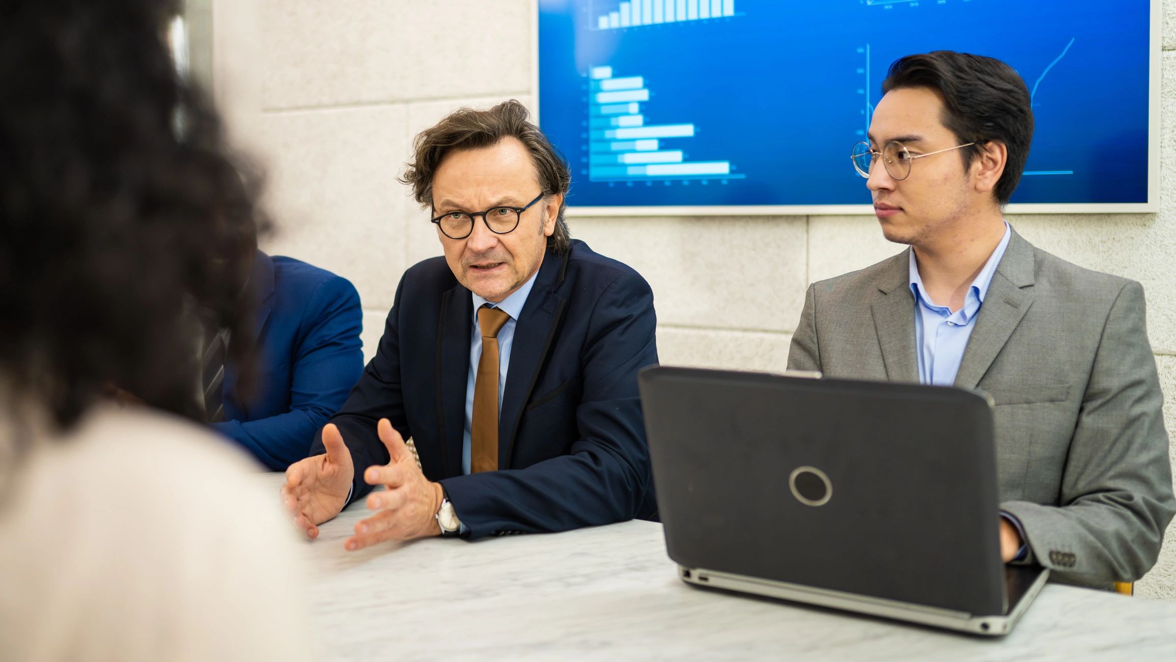 Board meeting with an Asian-majority executive group